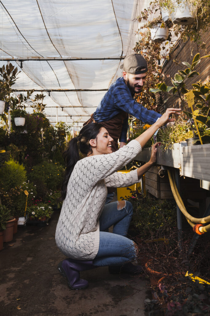 cheerful-people-taking-care-plants